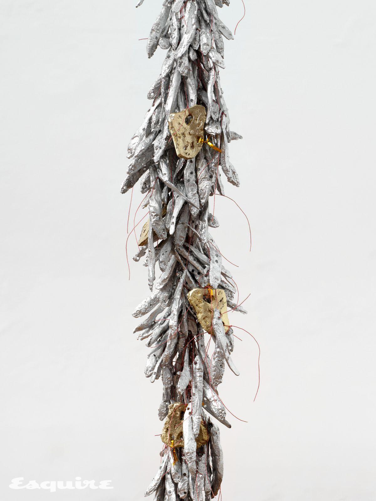 Tract XXIV, 2025 cast aluminum anchovies, cast bronze lotus root, metallic twist ties, nylon Approx. Installation visual. Courtesy of the artist. Photo Paul Salveson