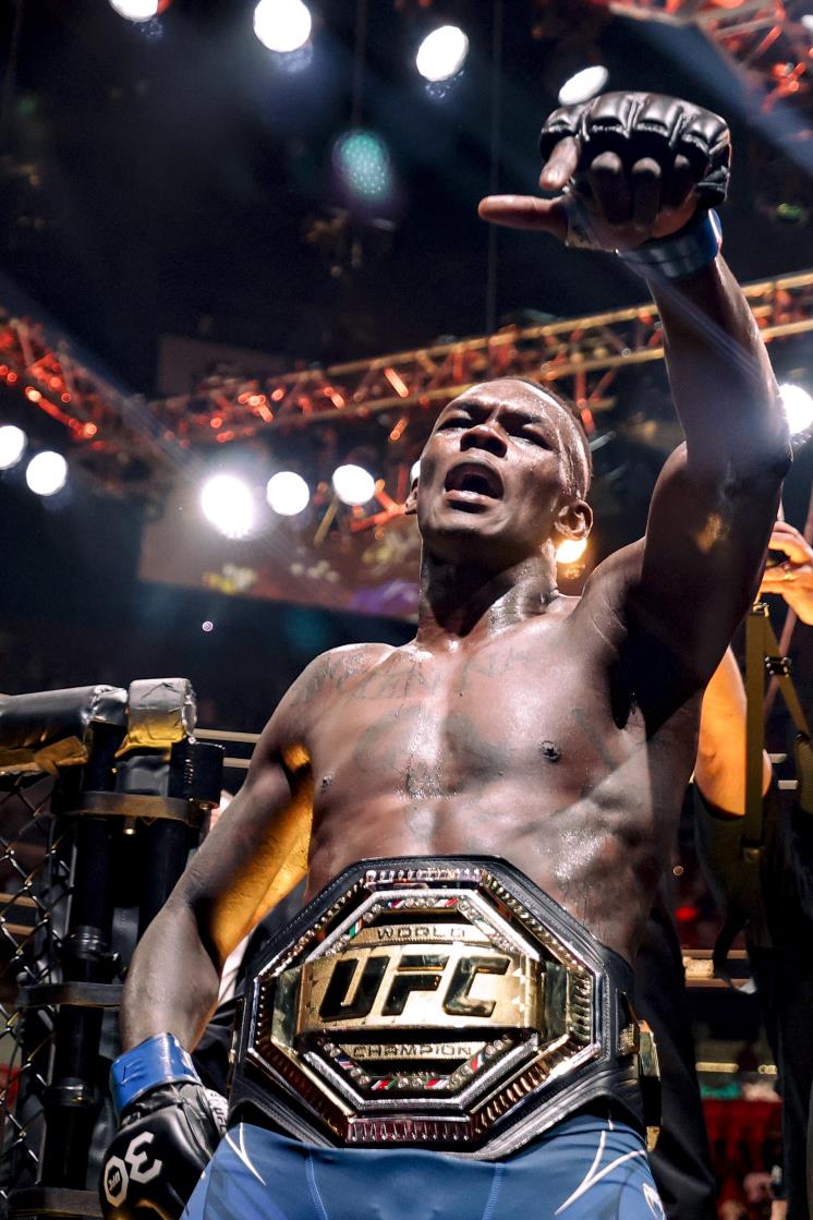 MIAMI, FLORIDA - APRIL 08: Israel Adesanya of Nigeria celebrates after knocking uot Alex Pereira of Brazil during their Middleweight fight at Kaseya Center on April 08, 2023 in Miami, Florida. (Photo by Carmen Mandato/Getty Images)