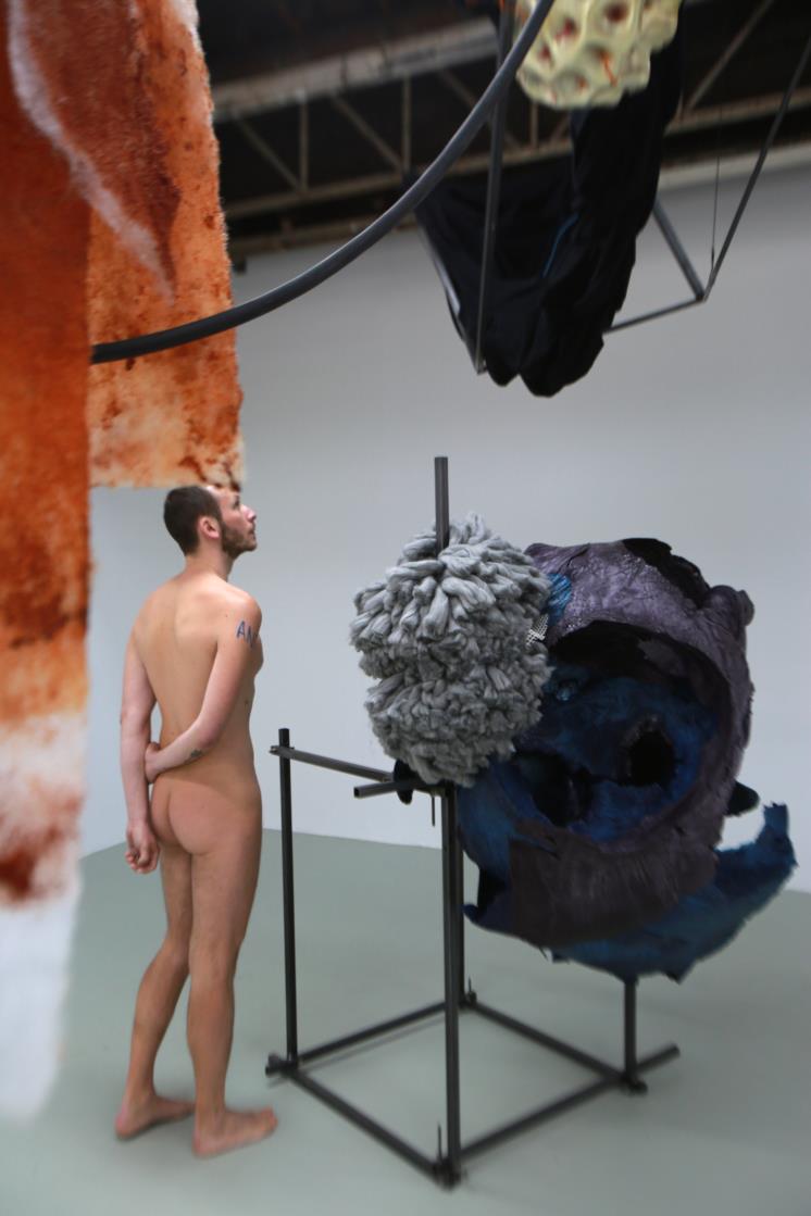 PARIS, FRANCE - MAY 05: (EDITORS NOTE: This image contains nudity) In an exhibit by Daiga Grantina, naturists attend a guided tour of exhibitions as part of 'Visite Naturiste' at Palais De Tokyo on May 5, 2018 in Paris, France. ″Visite Naturiste″ was organised in association with the Paris Naturist Association. (Photo by Owen Franken - Corbis/Corbis via Getty Images)