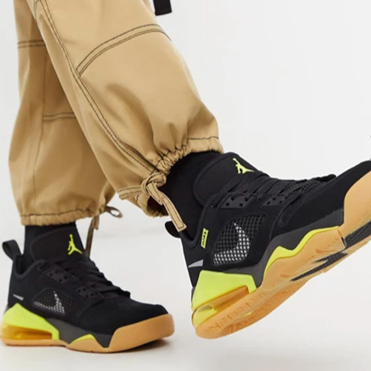 Jordan Mars 270 Low trainers in black/yellow, $206 USD