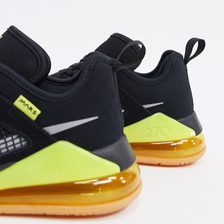 Jordan Mars 270 Low trainers in black/yellow, $206 USD
